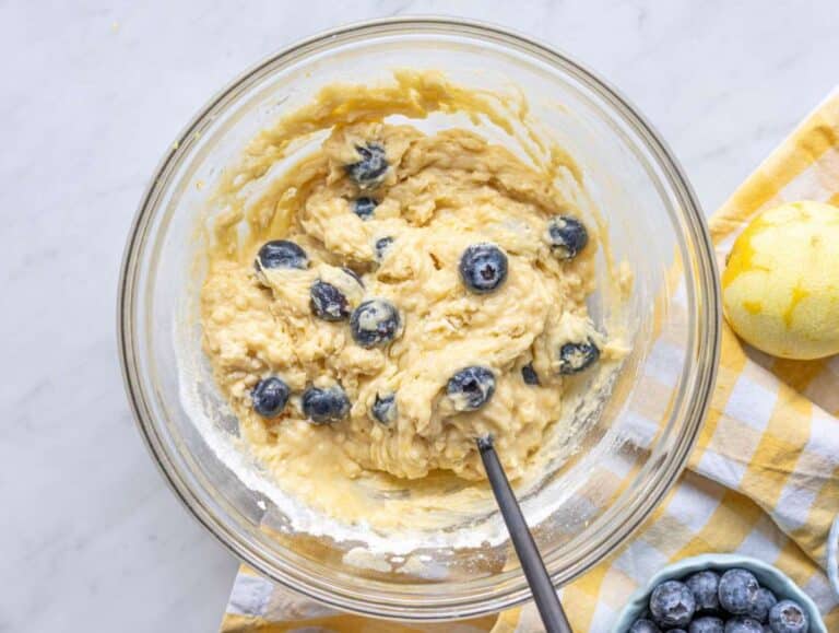 Step 3 Batter mixed in a bowl with blueberries folded in.