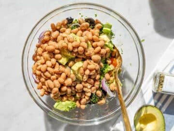 Step 3 Chopped vegetables in large bowl with cucumber, tomatoes, corn, and parsley.
