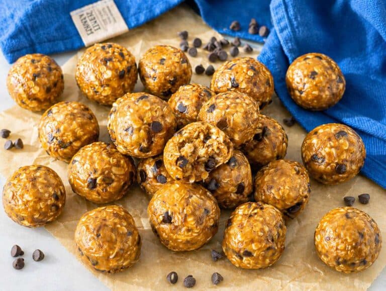 Step 4 Serving Peanut butter energy balls with oats and chocolate chips on parchment.