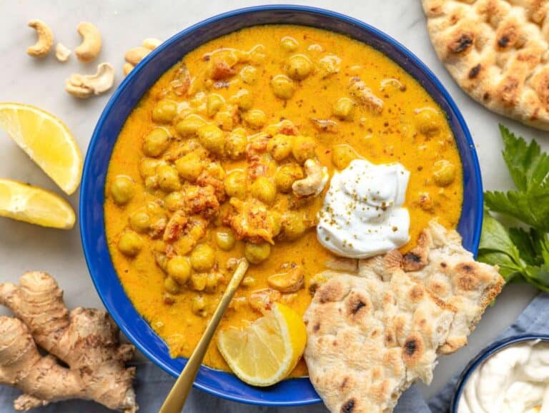 Step 4 Serving the curry in a bowl with naan and fresh lemon.