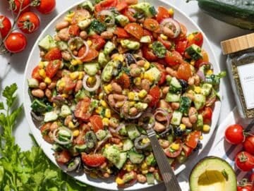 Step 4 Tossing pinto bean salad and serving it on a platter.