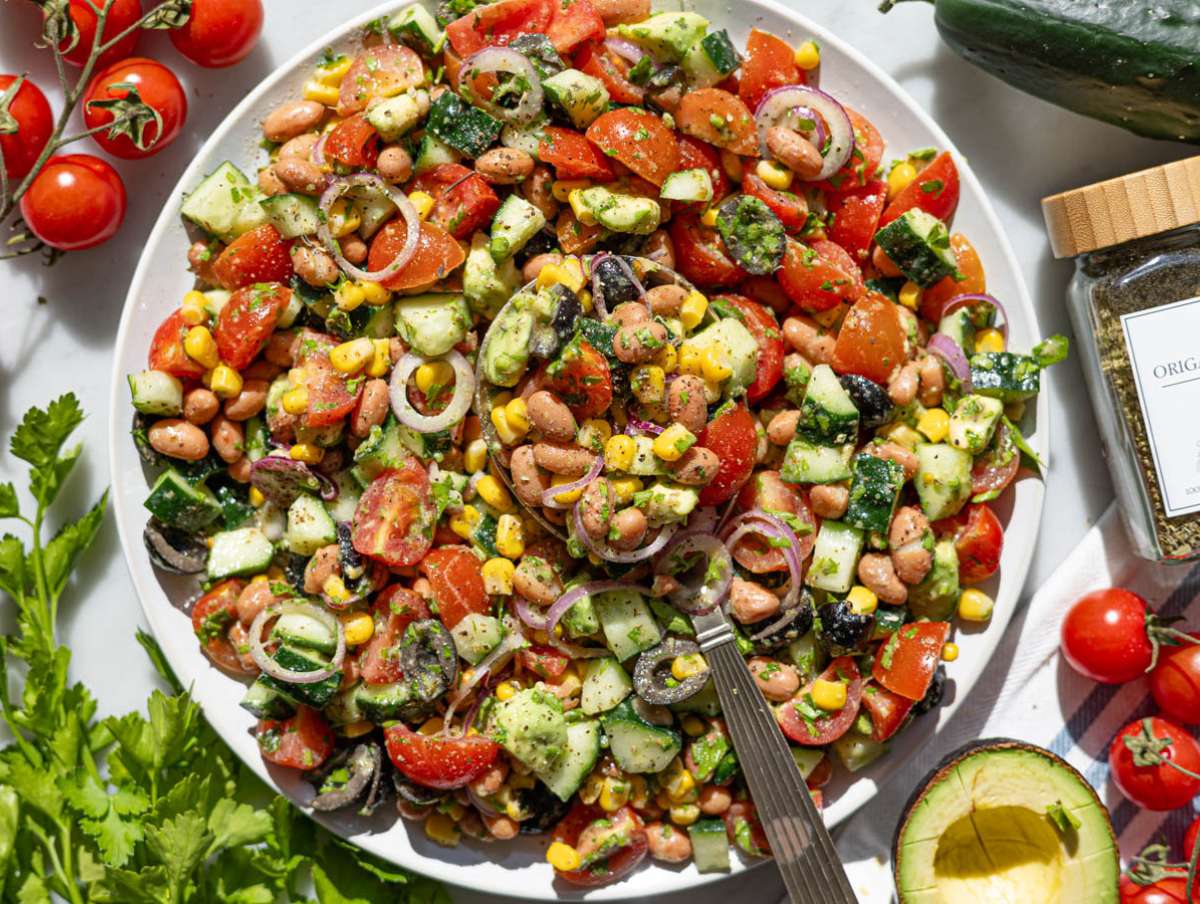Step 4 Tossing pinto bean salad and serving it on a platter.