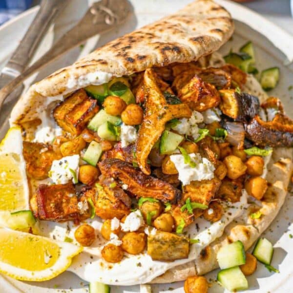 Vegetable shawarma served on warmed pita with simple fresh toppings.