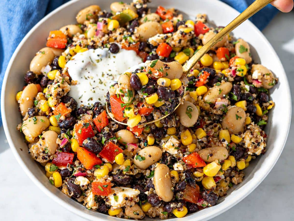 Bright Mexican bean salad bowl served with a dollop of Greek yogurt.