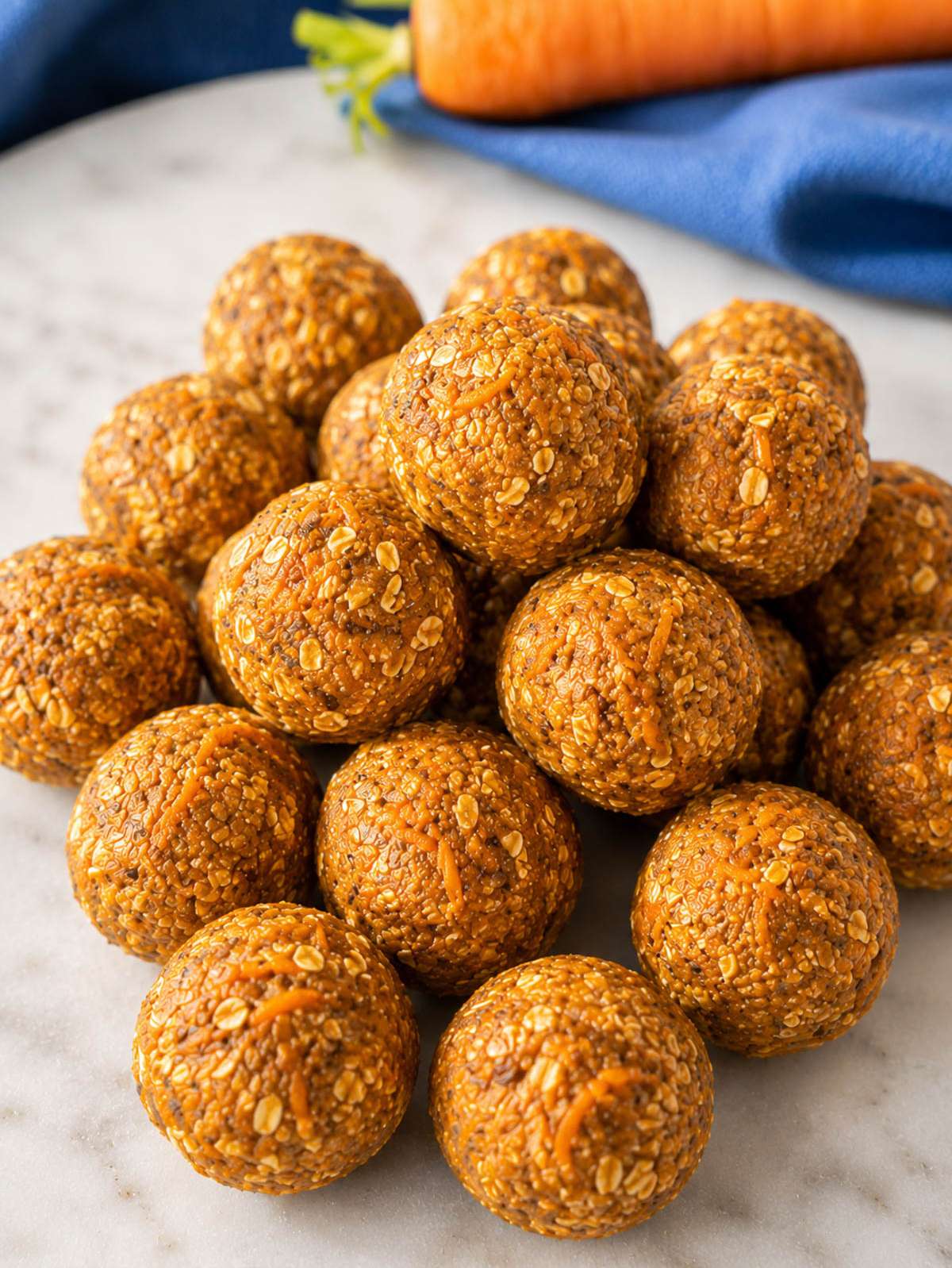 Carrot cake energy balls in natural window light.