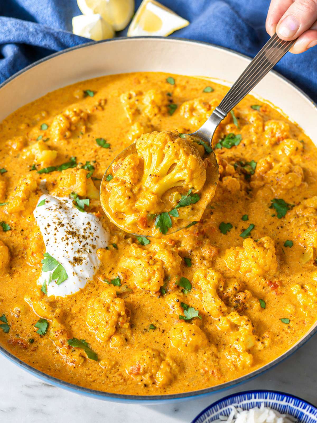 Close-up of cauliflower curry with tender chickpeas and creamy spiced sauce.