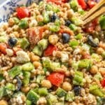 Greek farro salad with colorful vegetables and feta.