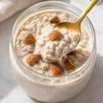 Protein overnight oats in jar with crunchy almonds.