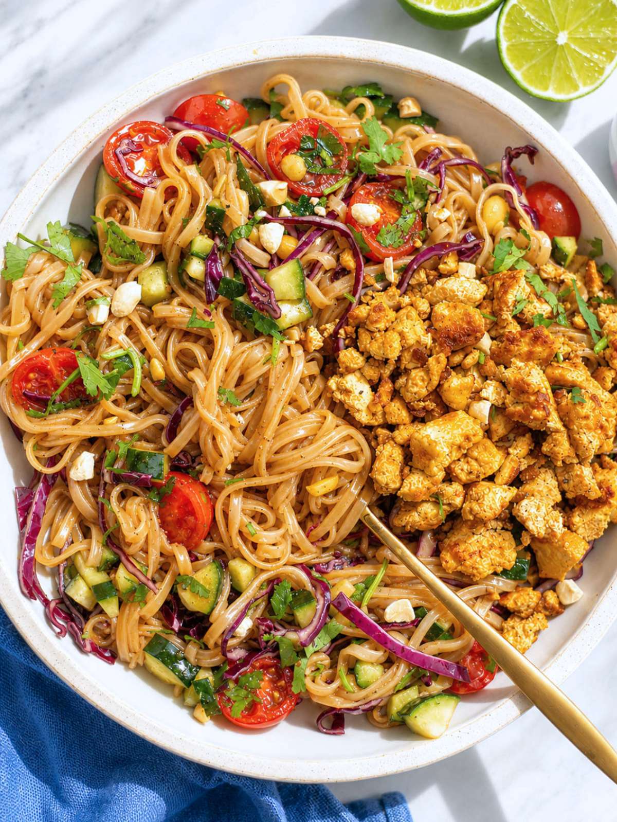 Spring roll bowl with crispy tofu and fresh vegetables tossed in dressing.