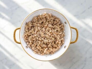 Step 1 Boiled pearled farro cooling down in a colander.