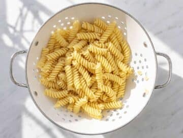 Step 1 Cooked pasta cooling in colander.