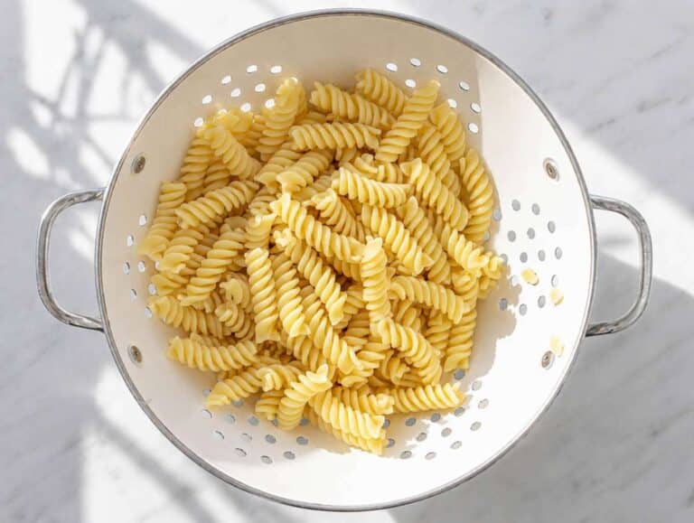 Step 1 Cooked pasta cooling in colander.