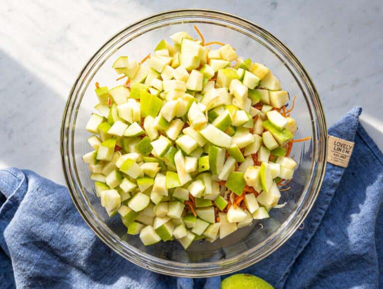 Step 1 Finely shredded cabbage, diced apples, grated carrots in a large mixing bowl.