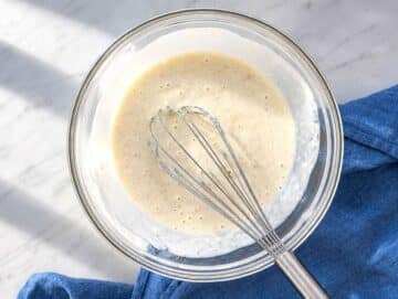 Step 1 Greek yogurt, egg, and milk whisked into banana mixture in glass bowl.