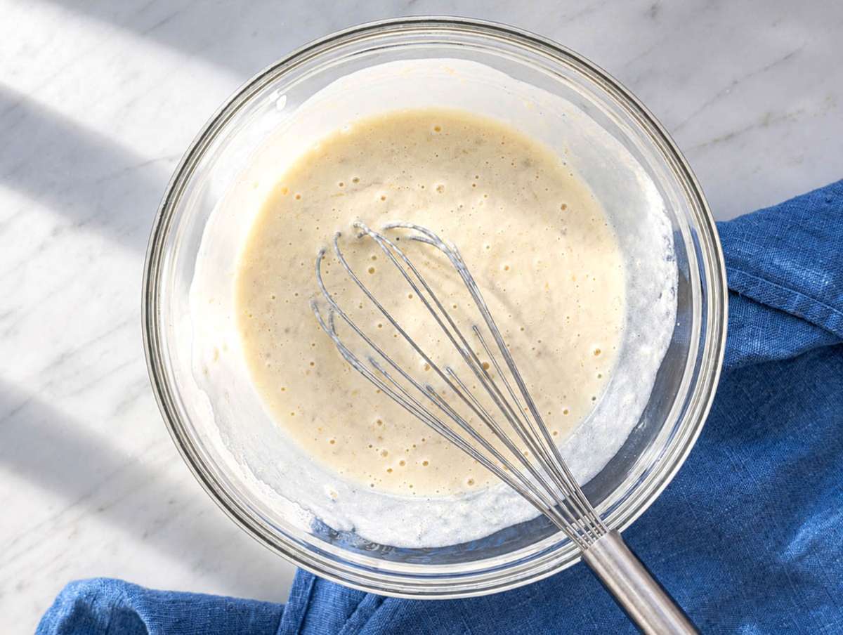 Step 1 Greek yogurt, egg, and milk whisked into banana mixture in glass bowl.