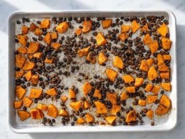 Step 1 Roasted sweet potatoes and black beans turning golden and slightly crisp in the oven.