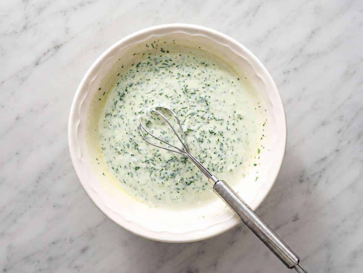 Step 2 Creamy cilantro lime dressing whisked in a small bowl.