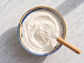 Step 2 Greek yogurt dressing whisked in a small bowl with mustard and vinegar.
