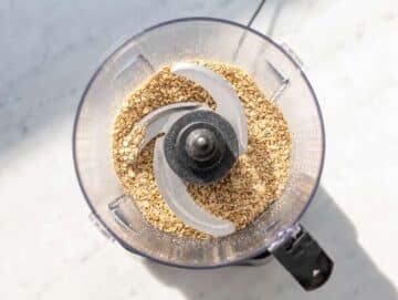 Step 2 Rolled oats and walnuts blended into crumbly mixture in food processor.