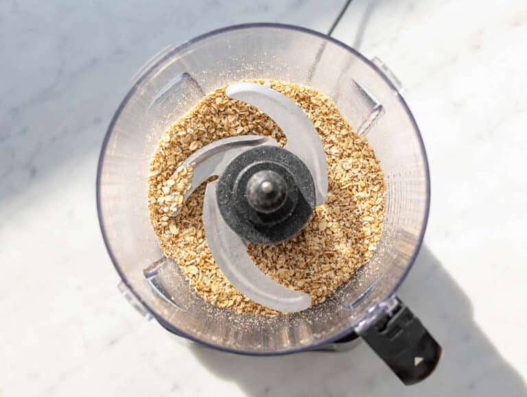 Step 2 Rolled oats and walnuts blended into crumbly mixture in food processor.