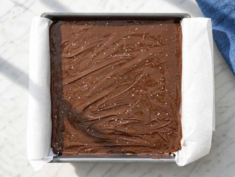 Step 3 Melted chocolate spread over peanut butter bars with flaky salt on top.