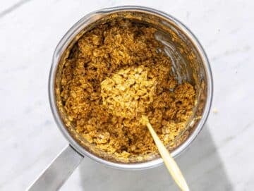Step 3 Rolled oats mixed into peanut butter mixture in a saucepan.