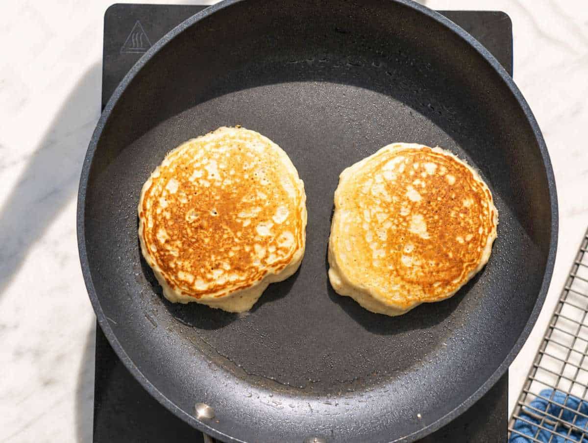 Step 3 Two protein pancakes cooking in lightly oiled skillet.
