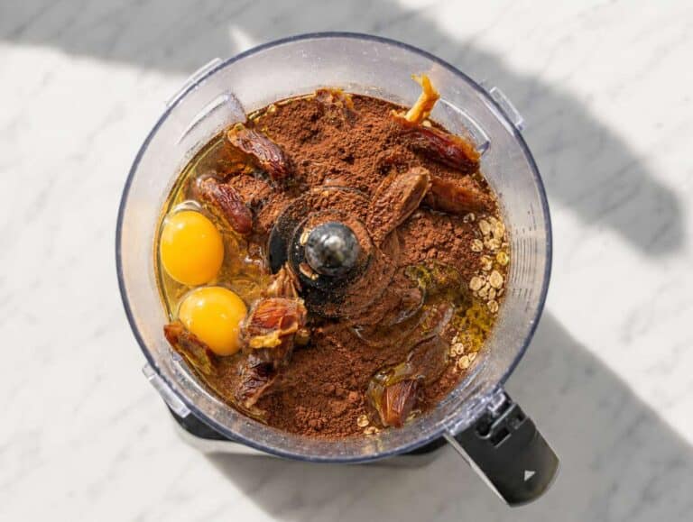 Step 3 oats, dates, eggs, olive oil, and cocoa powder in a food processor.