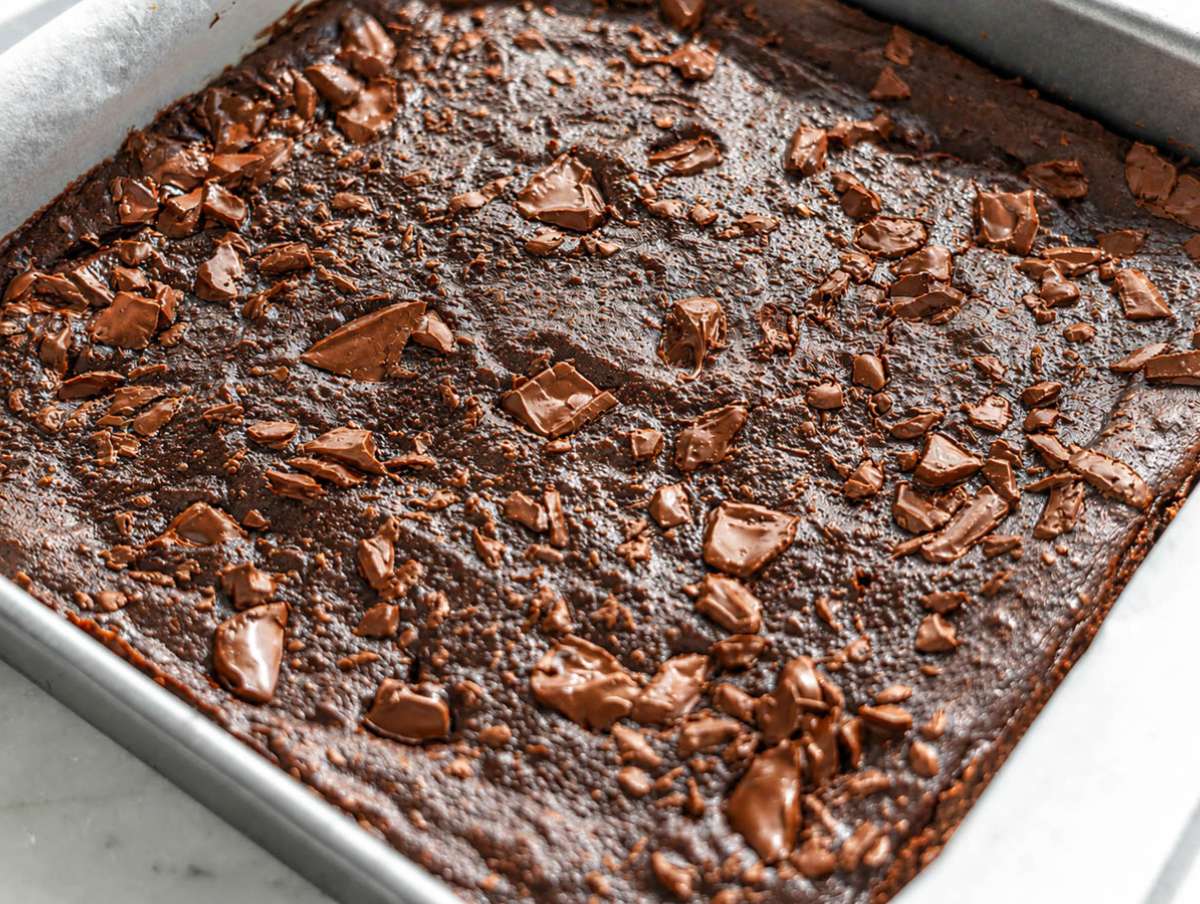Step 4 Baked date brownies cooling in baking pan before cutting.