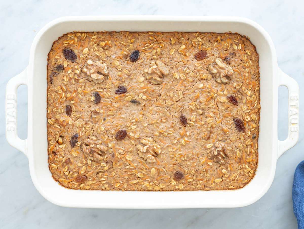 Step 4 Freshly baked carrot cake baked oatmeal resting in dish with golden edges.
