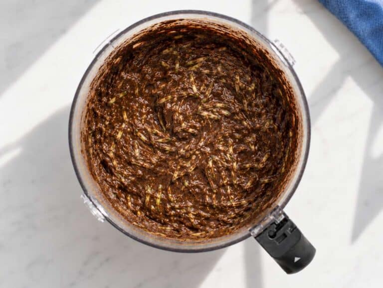 Step 4 Grated zucchini folded into thick chocolate brownie batter.