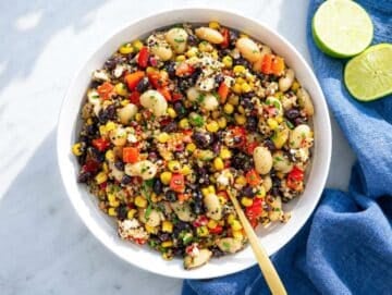 Step 4 Mexican bean salad tossed with dressing in a bowl.