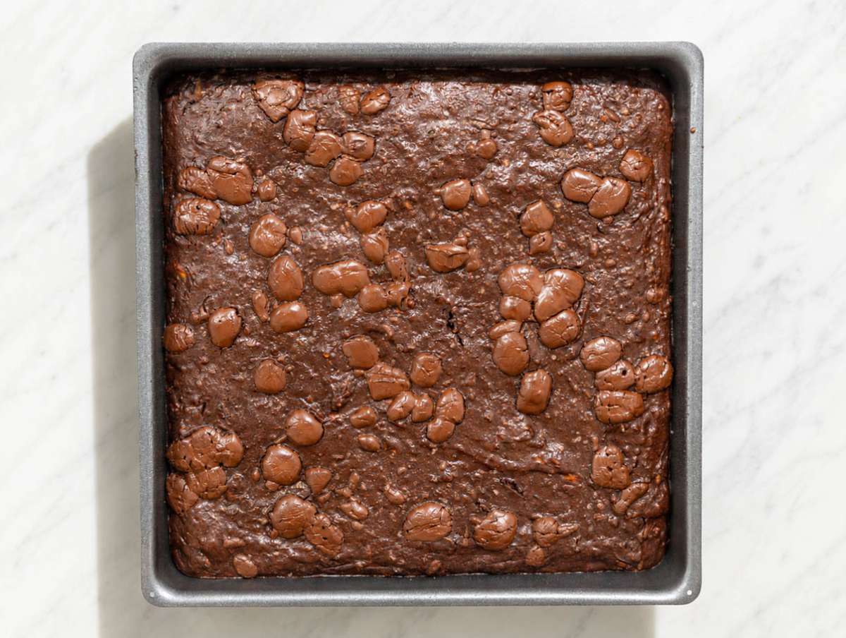 Step 5 Healthy zucchini brownies cooling in a baking pan.