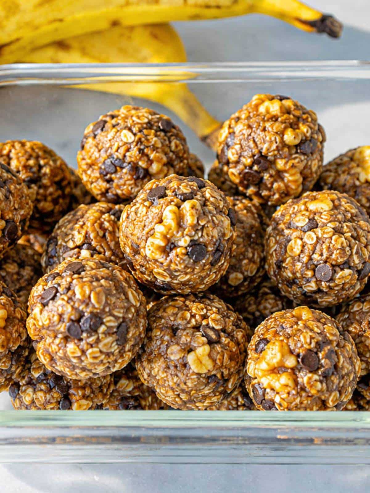 Close-up of energy ball showing banana pieces and walnuts.