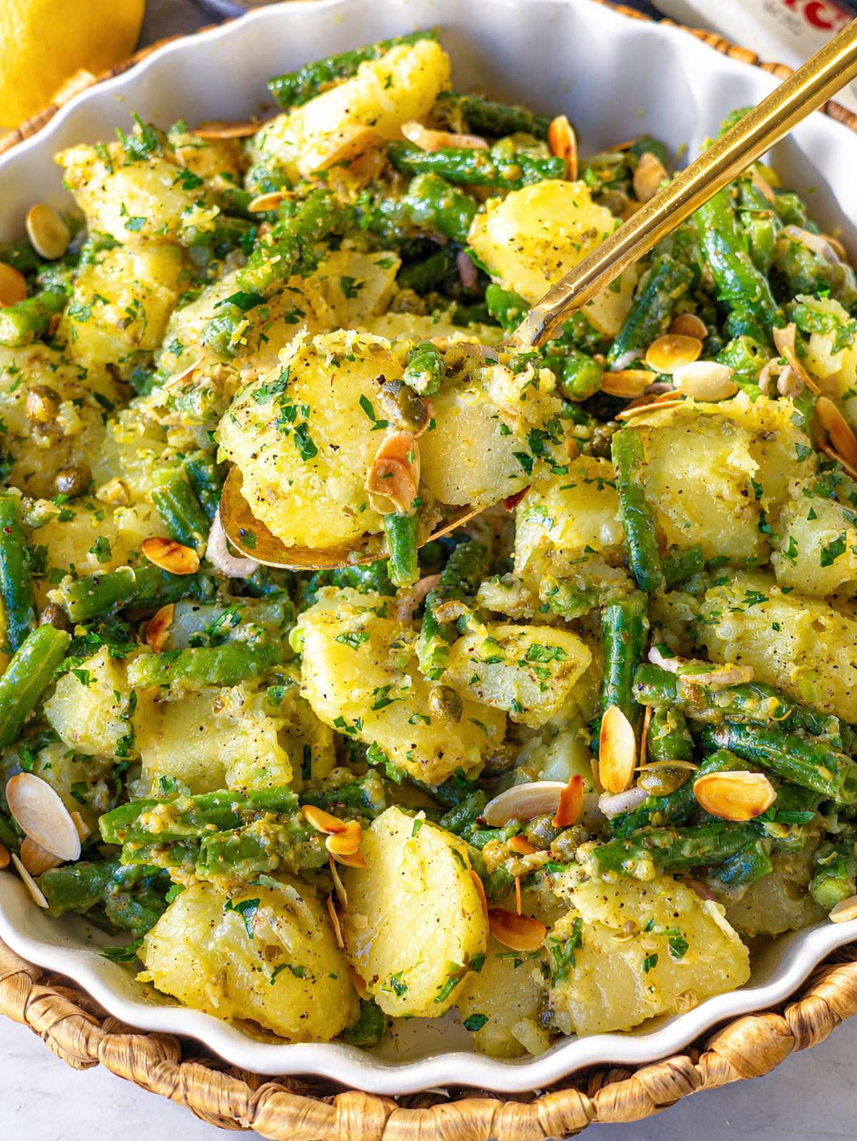 Close-up of lemony potato salad and capers.
