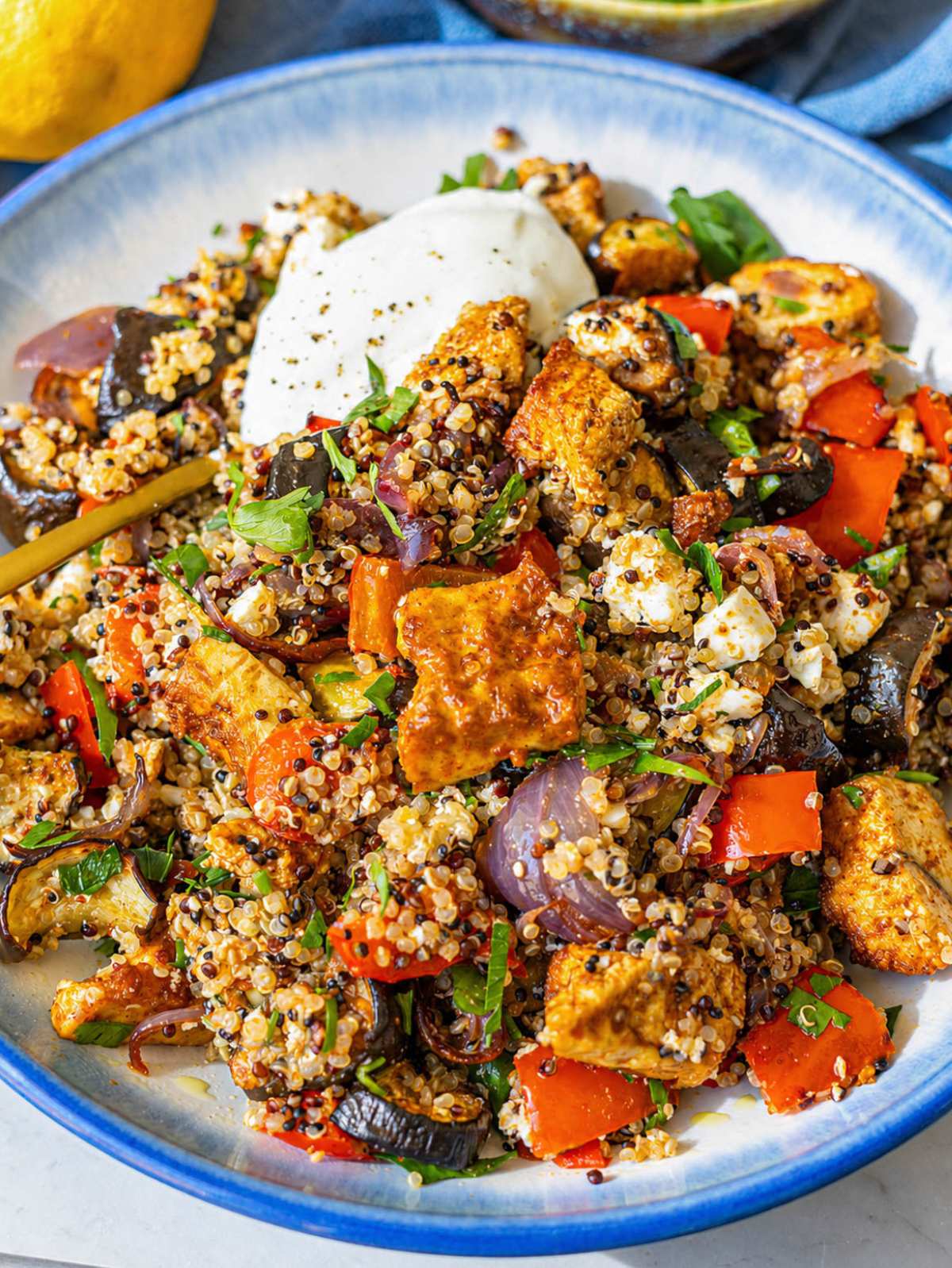 Close-up tofu shawarma bowl with roasted vegetables.