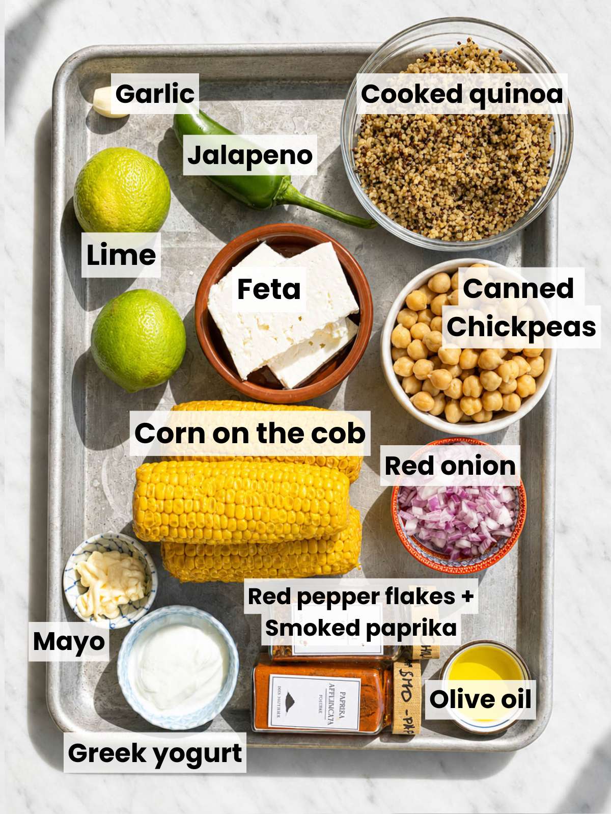 Corn, quinoa, chickpeas, herbs, feta, and dressing ingredients.
