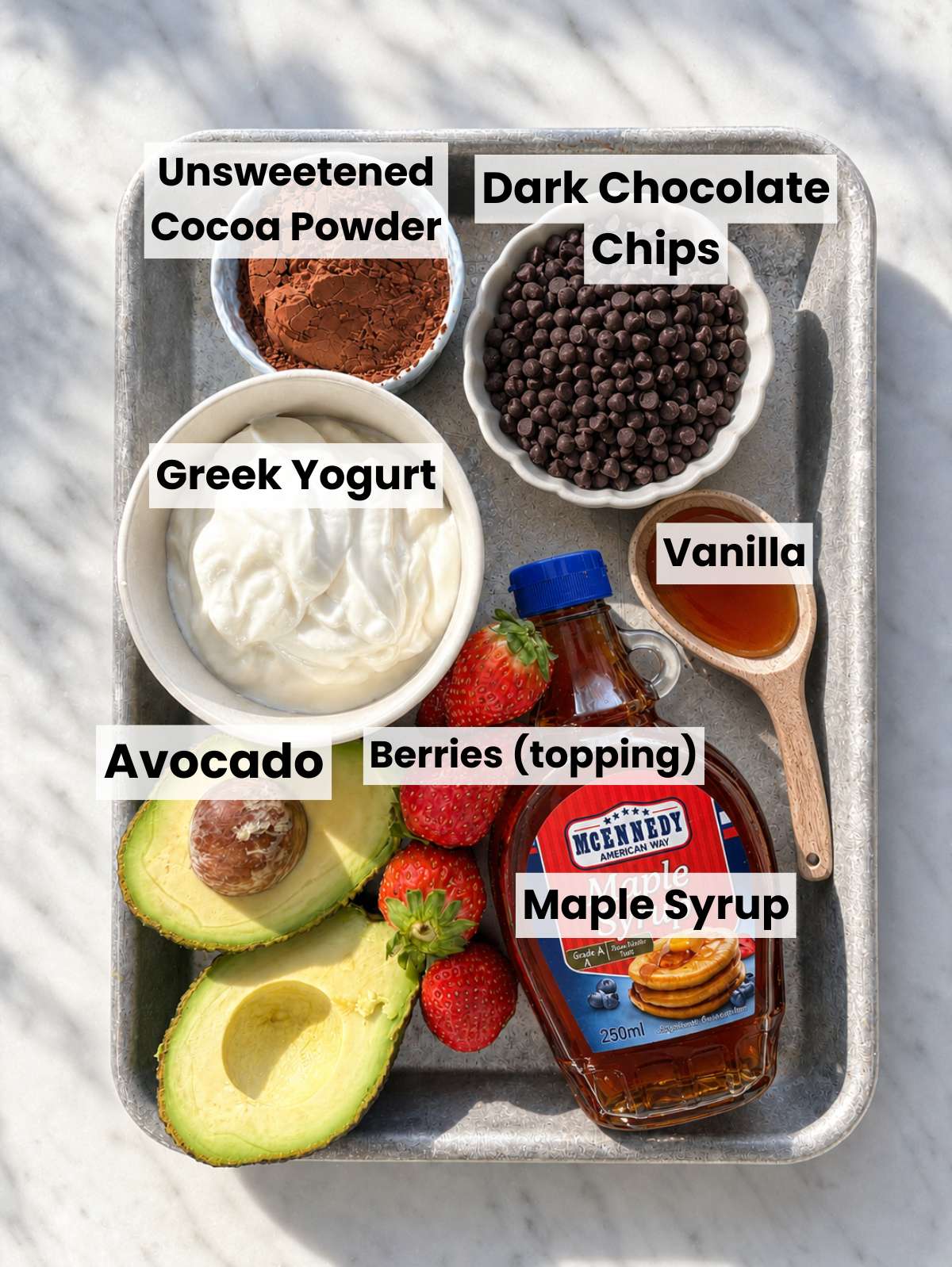 Measured mousse ingredients arranged on marble surface.
