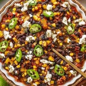 No cook chili served with feta and cilantro and a spoon.