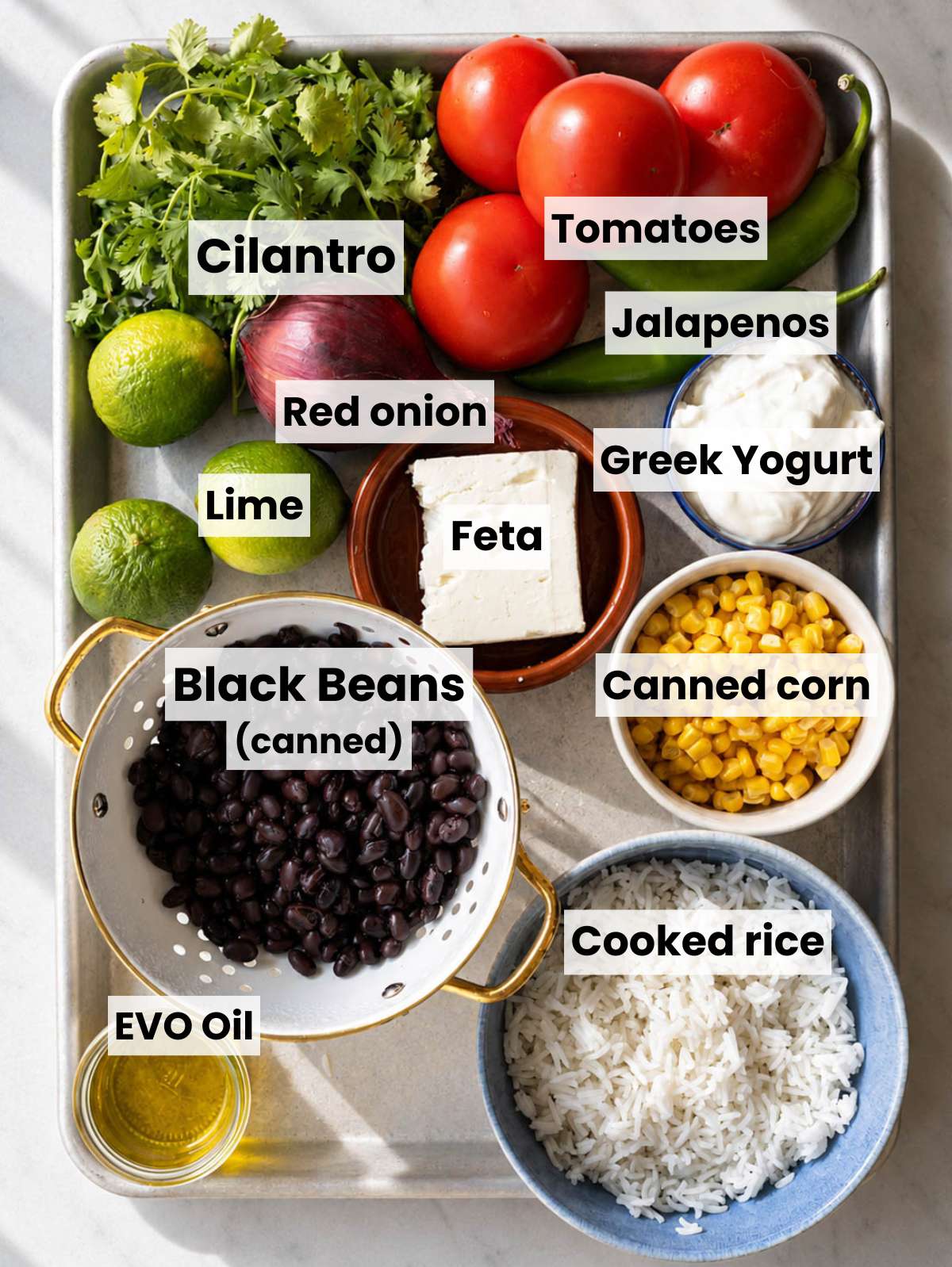 Rice, beans, corn, feta, and pico ingredients.