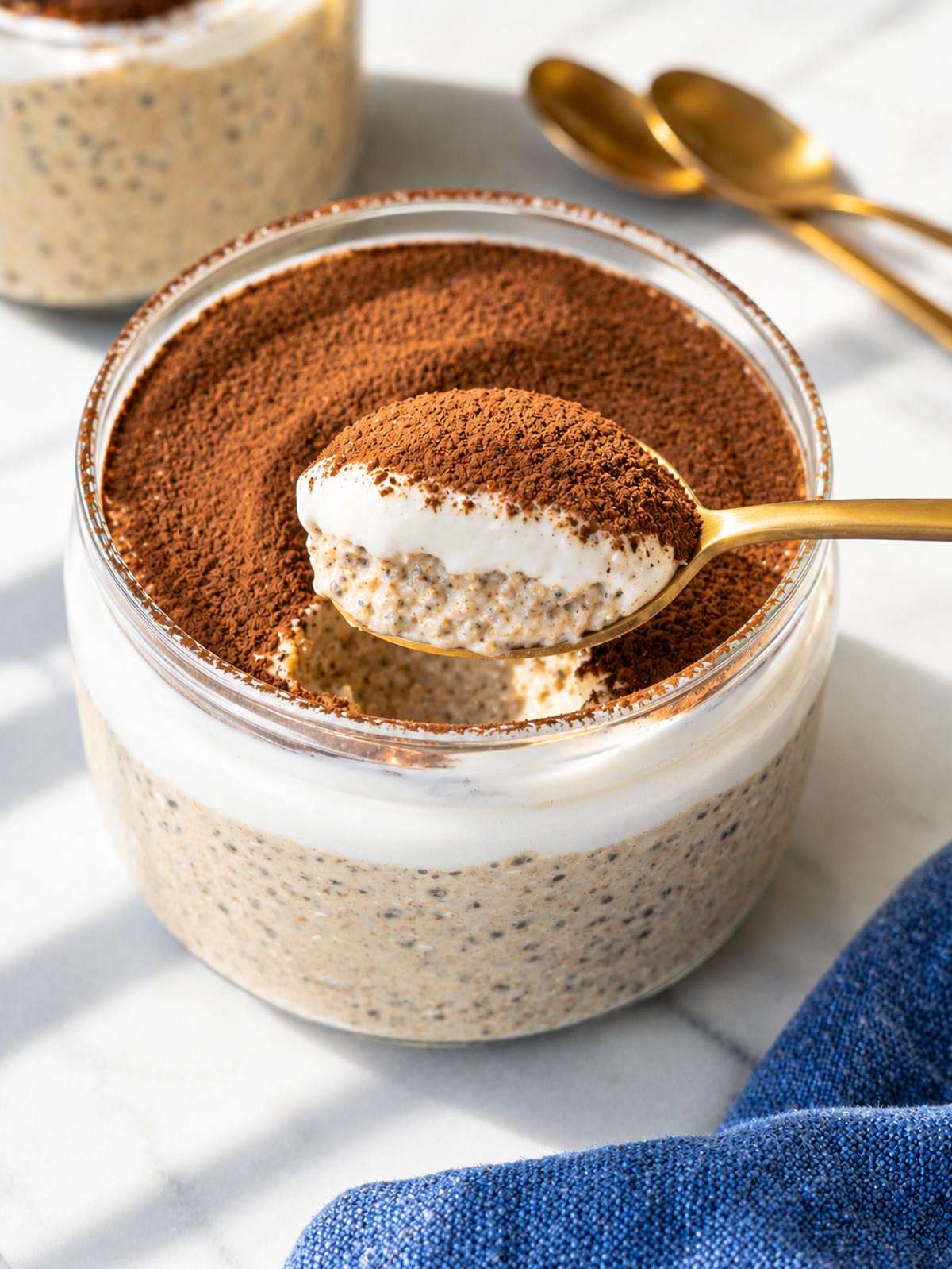 Spoonful of creamy tiramisu overnight oats.