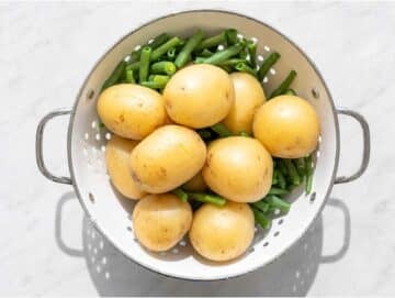 Step 1 Boiled potatoes and green beans draining.
