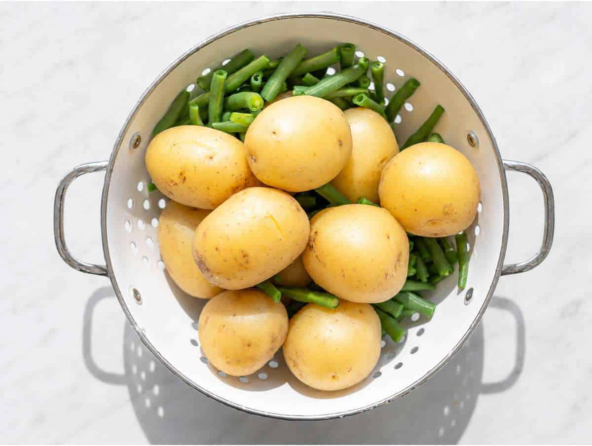 Step 1 Boiled potatoes and green beans draining.