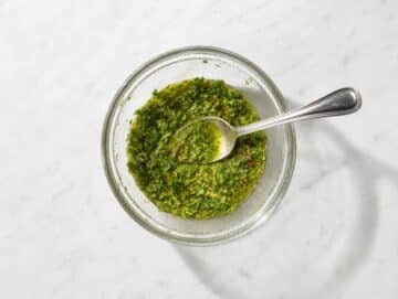Step 1 Chopped parsley, olive oil, vinegar, garlic, and spices whisked into chimichurri dressing.