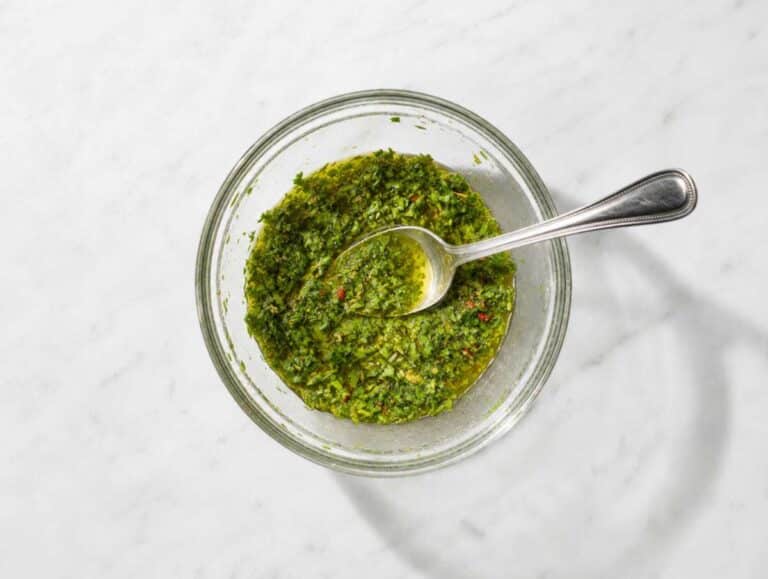 Step 1 Chopped parsley, olive oil, vinegar, garlic, and spices whisked into chimichurri dressing.