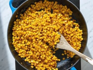 Step 1 Corn kernels charring in a skillet with smoked paprika.