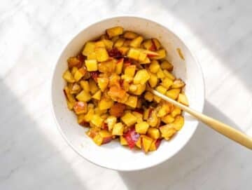 Step 1 Diced peaches tossed with cinnamon in a small bowl.