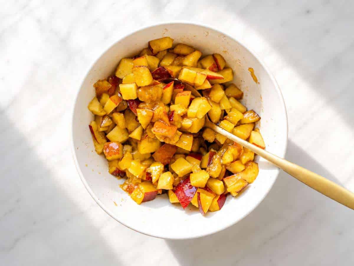 Step 1 Diced peaches tossed with cinnamon in a small bowl.