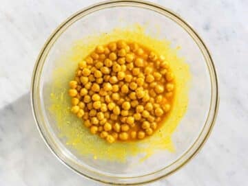 Step 2 Chickpeas coated evenly in golden turmeric dressing before marinating.