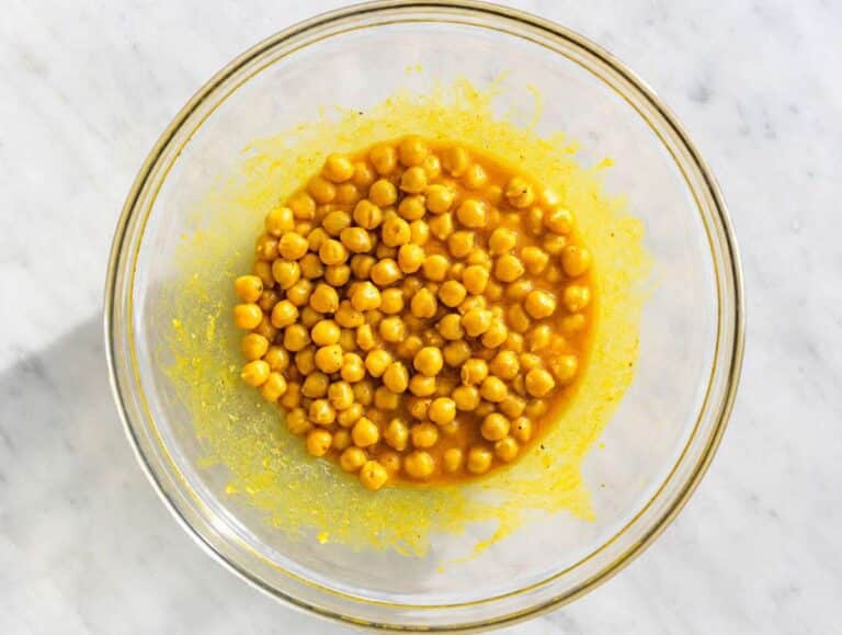 Step 2 Chickpeas coated evenly in golden turmeric dressing before marinating.
